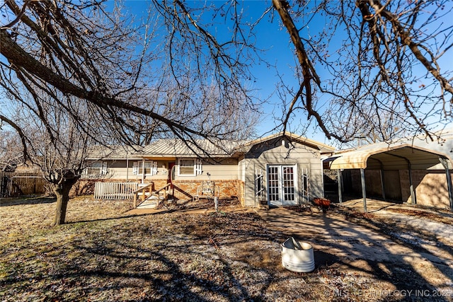 back of property featuring a carport