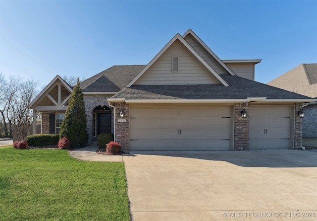 view of front of house featuring a garage and a front yard