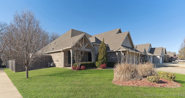 view of front of home featuring a garage and a front lawn