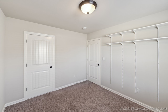 unfurnished bedroom featuring carpet and a closet