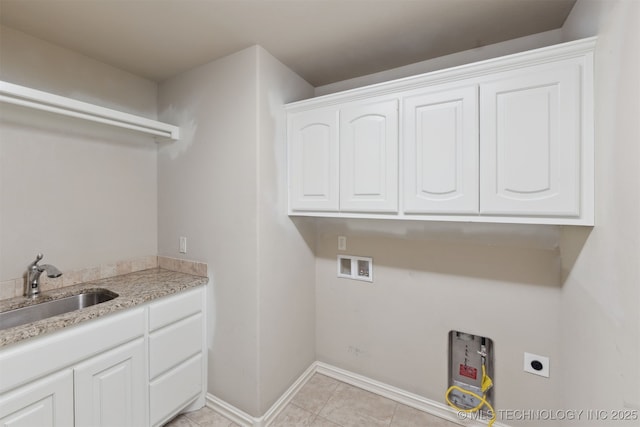 laundry room featuring cabinets, washer hookup, electric dryer hookup, sink, and light tile patterned floors