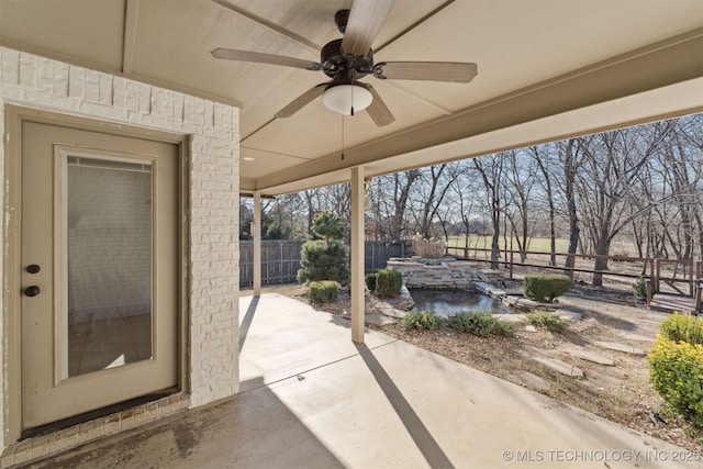 view of patio featuring ceiling fan