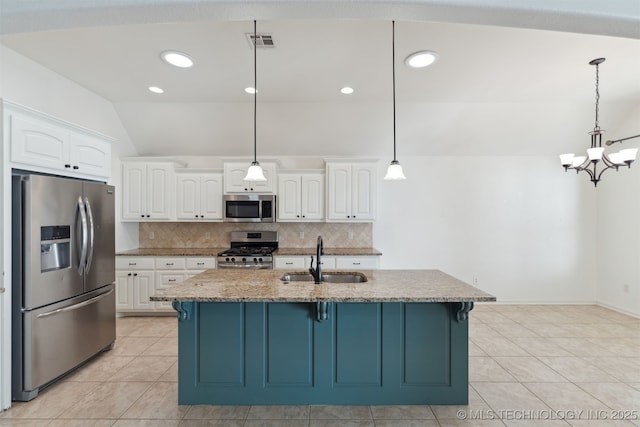 kitchen with appliances with stainless steel finishes, white cabinetry, pendant lighting, and sink