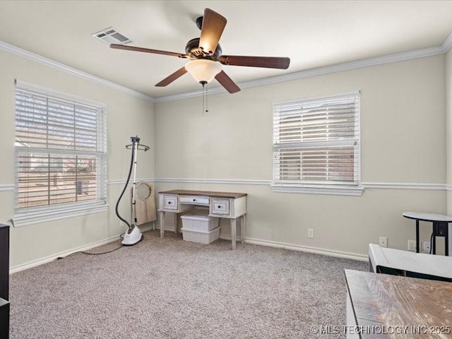 interior space featuring carpet flooring, ceiling fan, and crown molding