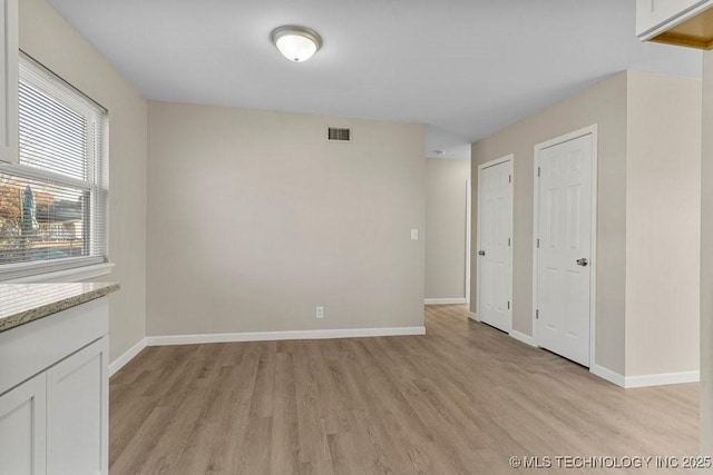 empty room featuring light wood-type flooring