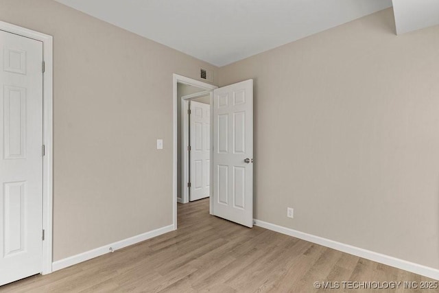 unfurnished bedroom featuring light hardwood / wood-style flooring