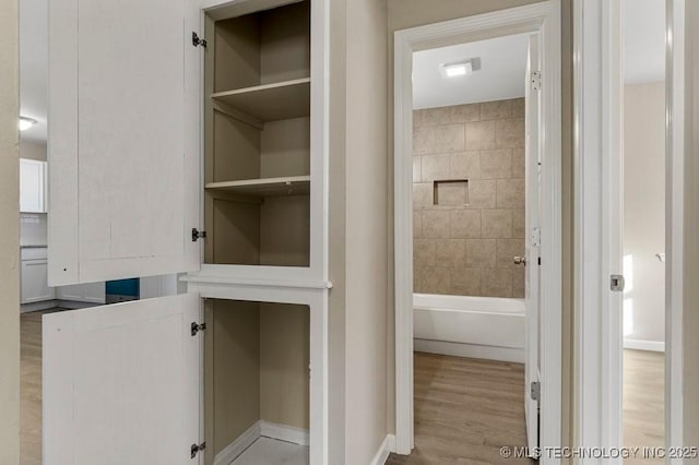 bathroom featuring wood-type flooring