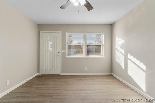 foyer featuring ceiling fan and light hardwood / wood-style floors