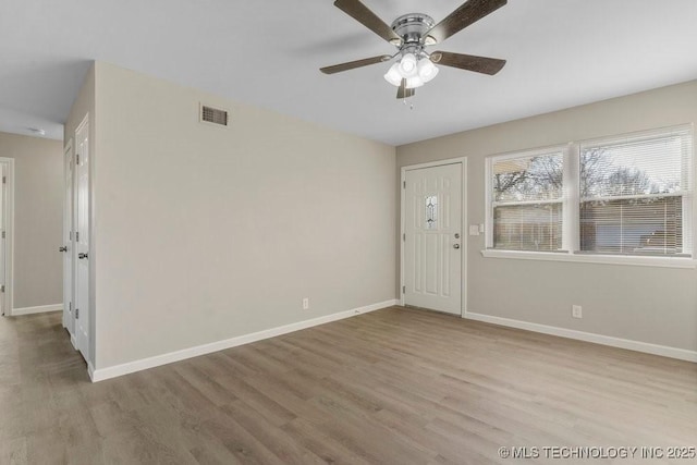 foyer entrance featuring ceiling fan and light hardwood / wood-style flooring