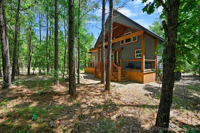 view of home's exterior featuring a wooden deck