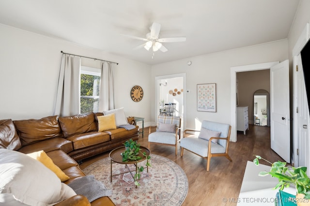 living room featuring hardwood / wood-style flooring and ceiling fan