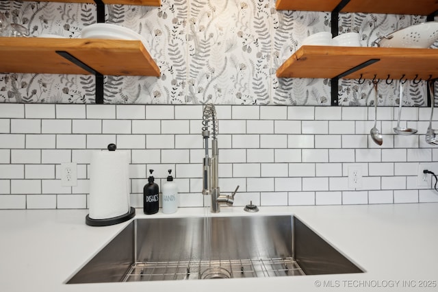 kitchen featuring decorative backsplash and sink