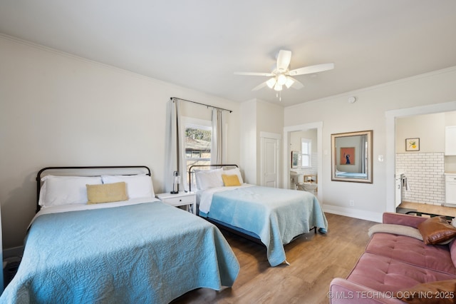 bedroom with ceiling fan, ornamental molding, and light hardwood / wood-style flooring