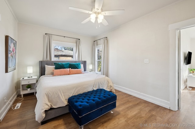 bedroom with hardwood / wood-style floors and ceiling fan