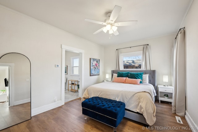 bedroom featuring wood-type flooring and ceiling fan