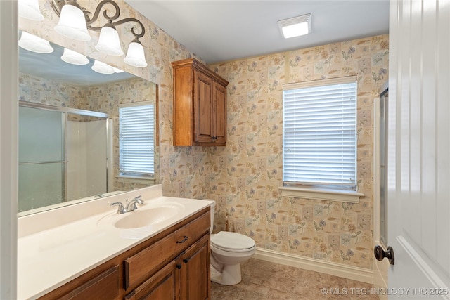 bathroom with walk in shower, tile patterned flooring, vanity, and toilet