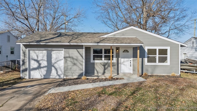 ranch-style home featuring a garage