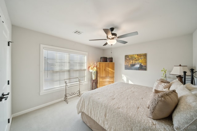 bedroom with ceiling fan and carpet floors