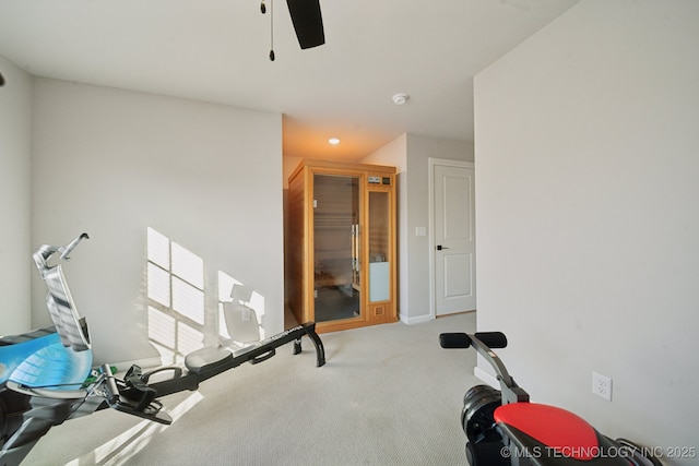 workout area featuring carpet flooring and ceiling fan