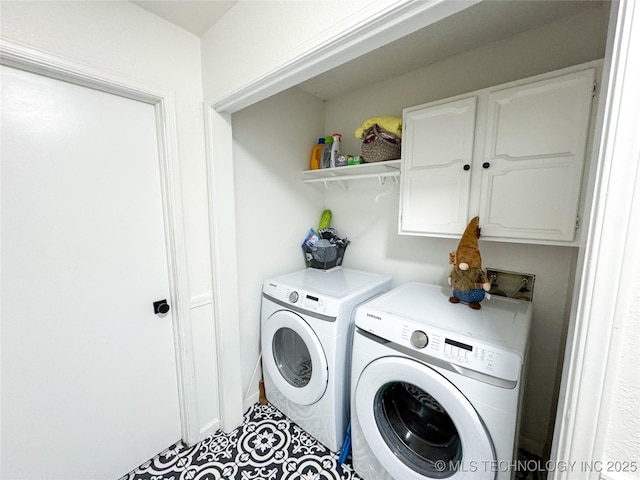 laundry area with cabinets and separate washer and dryer