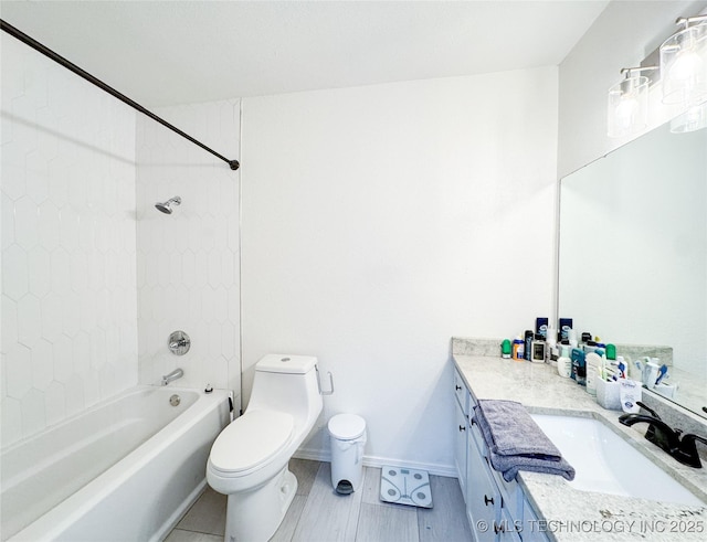 full bathroom with vanity, toilet, and tiled shower / bath