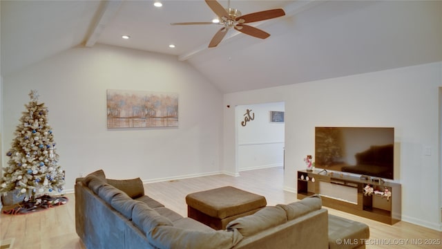 living room featuring vaulted ceiling with beams, ceiling fan, and light hardwood / wood-style flooring