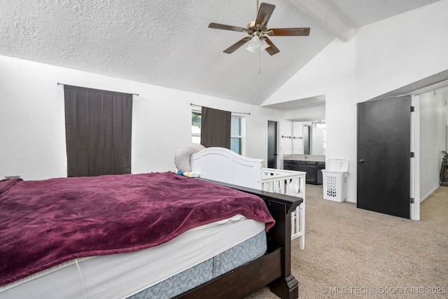 bedroom featuring a textured ceiling, high vaulted ceiling, connected bathroom, light colored carpet, and beamed ceiling