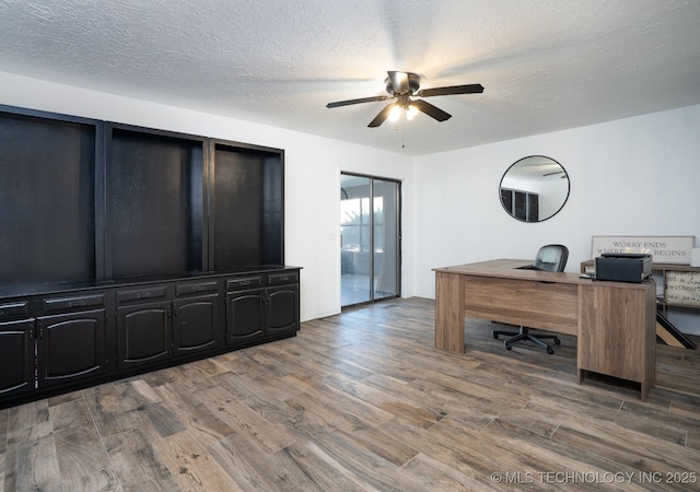 office space featuring a textured ceiling and wood finished floors