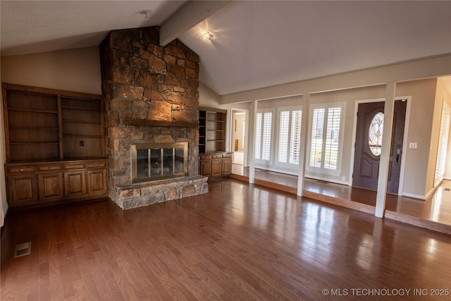 unfurnished living room featuring a fireplace, vaulted ceiling with beams, and hardwood / wood-style flooring