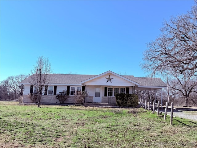 ranch-style house with a front lawn