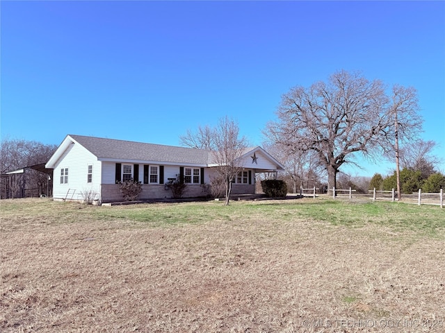 ranch-style home with a front yard