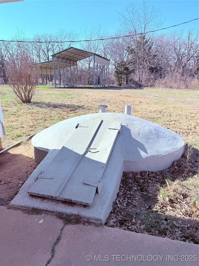 view of storm shelter with a lawn