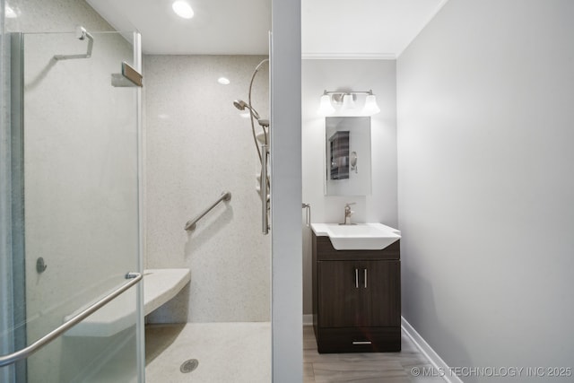 bathroom featuring vanity and a shower with door