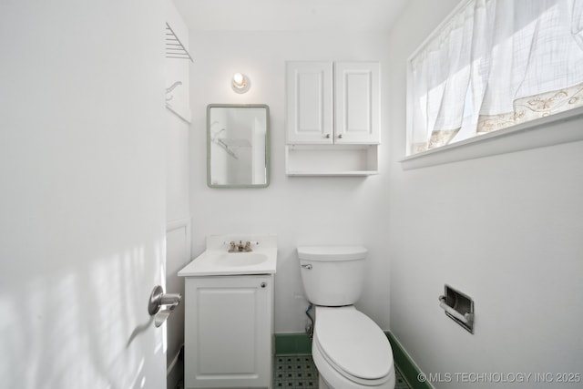 bathroom with vanity and toilet