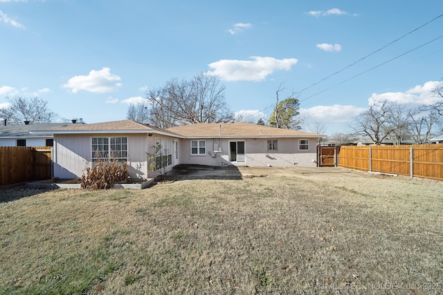 back of house with a yard