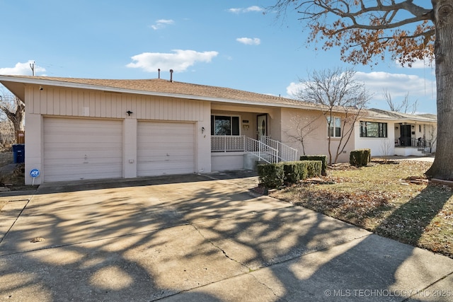 ranch-style home with covered porch and a garage