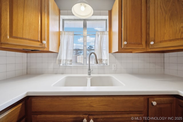 kitchen with backsplash and sink