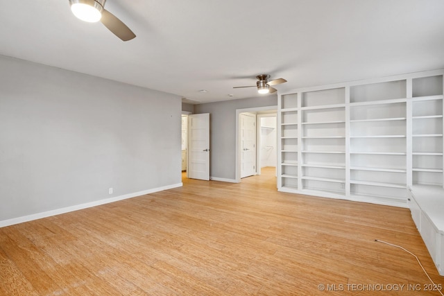 empty room featuring light wood-type flooring and ceiling fan