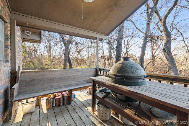 wooden deck featuring ceiling fan