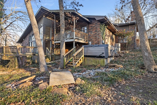 back of house featuring a wooden deck