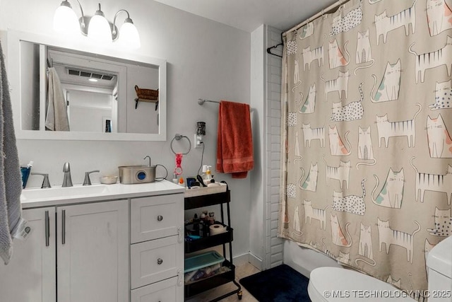 full bathroom featuring vanity, toilet, and shower / bathtub combination with curtain