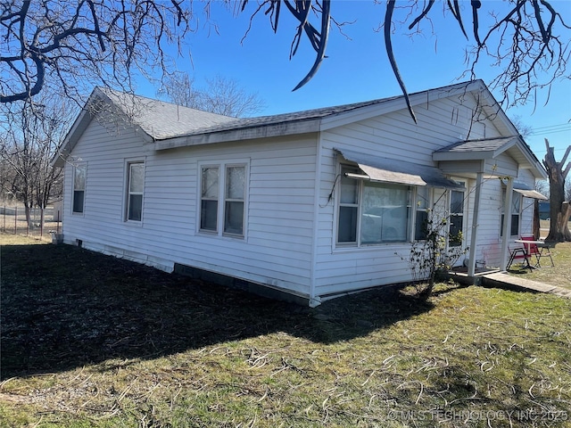 view of home's exterior featuring a lawn