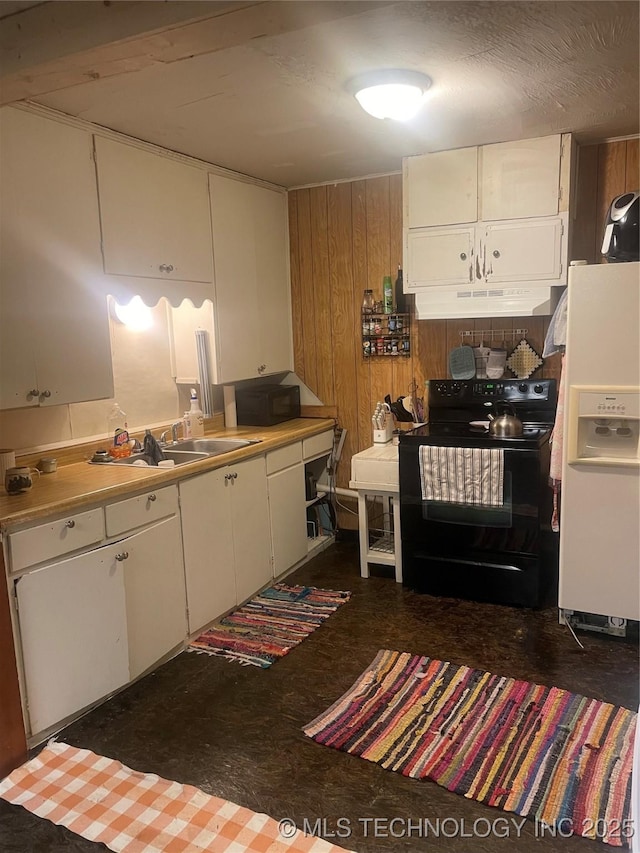 kitchen with sink, black electric range oven, white refrigerator with ice dispenser, washer / clothes dryer, and wooden walls