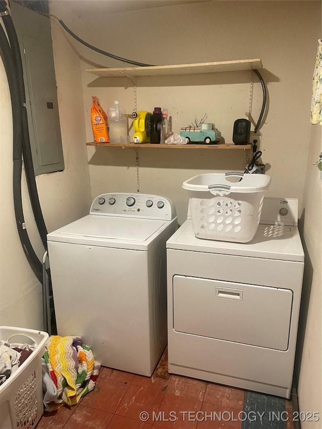 laundry area featuring washing machine and dryer and electric panel