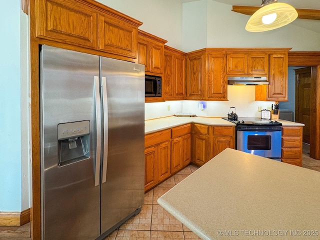 kitchen featuring stainless steel appliances and pendant lighting