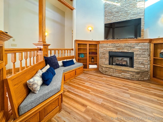 living room with hardwood / wood-style floors and a fireplace