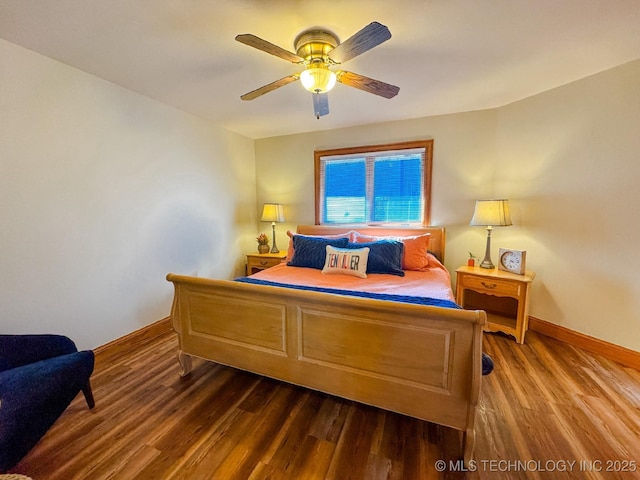 bedroom featuring ceiling fan and dark hardwood / wood-style flooring