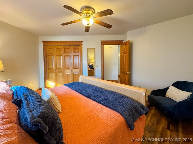 bedroom with dark wood-type flooring and ceiling fan