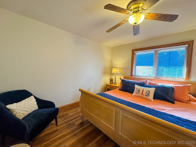 bedroom with dark wood-type flooring and ceiling fan