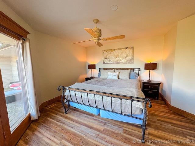 bedroom featuring ceiling fan and wood-type flooring